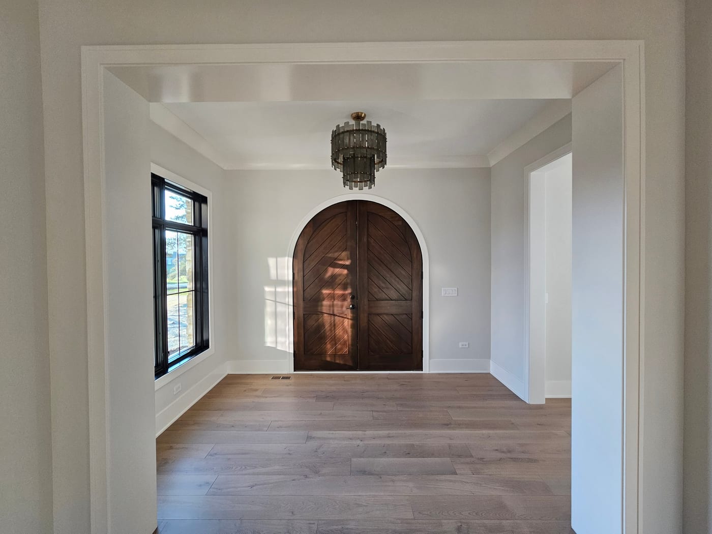 Foyer Light Gray Walls Arched Wood Doors Chandelier - Interior Painting by Z&Z Painting