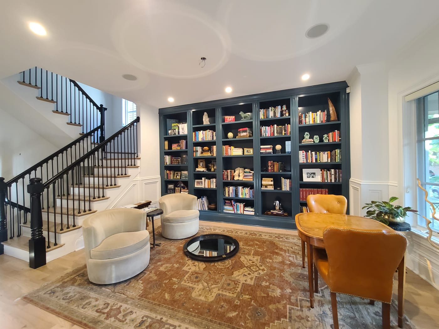 Library Navy Built In Bookshelves Iron Stair Railing - Interior Painting by Z&Z Painting