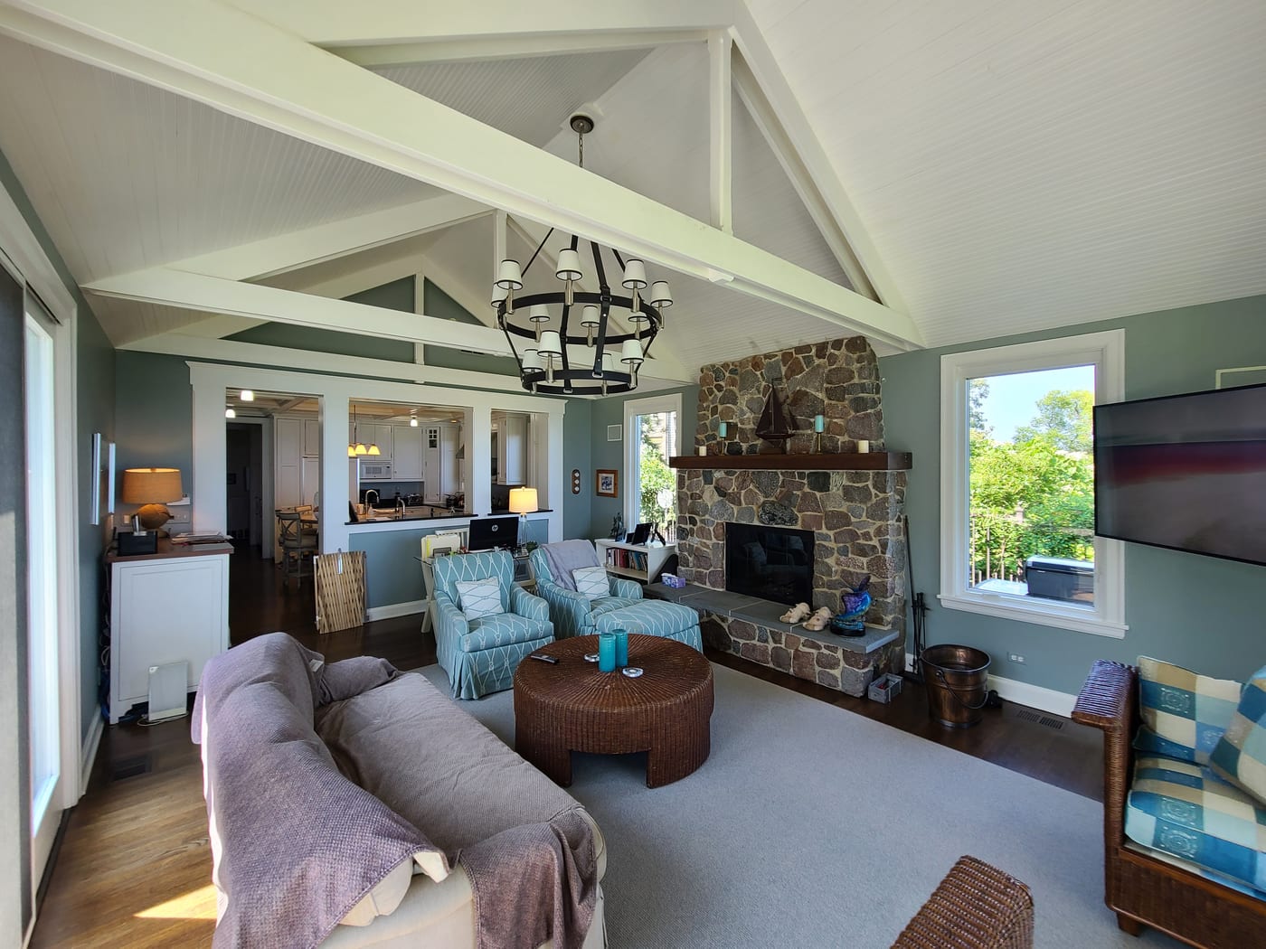 Living Room Sage Green Walls Stone Fireplace Beams - Interior Painting by Z&Z Painting