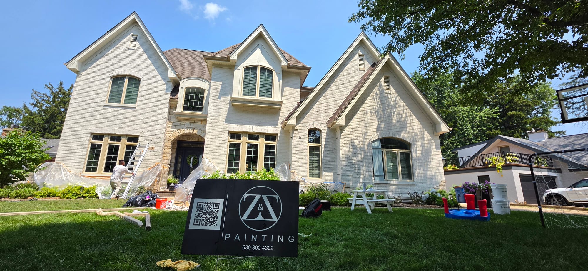 Limewash masonry flat brick exterior before during application.